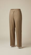 A pair of versatile linen trousers from the 'Disciplined Elegance' collection, reflecting the minimalist design and...